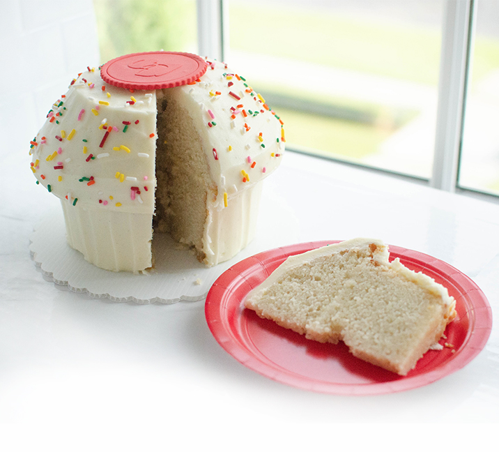 We bake our cupcakes fresh daily. (Shown: Giant Vanilla Cupcake cupcakes.)