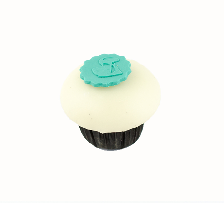 We bake our cupcakes fresh daily. (Shown: Vanilla  cupcakes.)